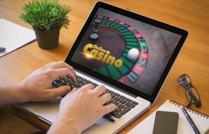 playing casino online on laptop
