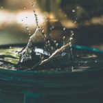 Water in a big container and the way that water is treated and circulated.