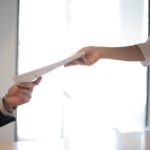 Applicant submitting documents for job