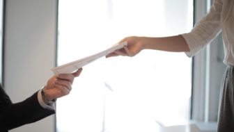 Applicant submitting documents for job