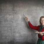 A Math tutor teaching on the board