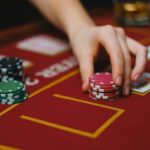 Lady piling up the coins to play