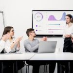 Lady presenting her finance team