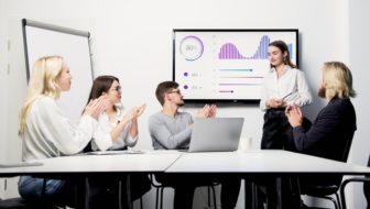Lady presenting her finance team