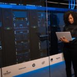 Woman checking her laptop for data