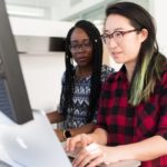 women looking into the computer