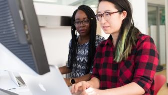 women looking into the computer