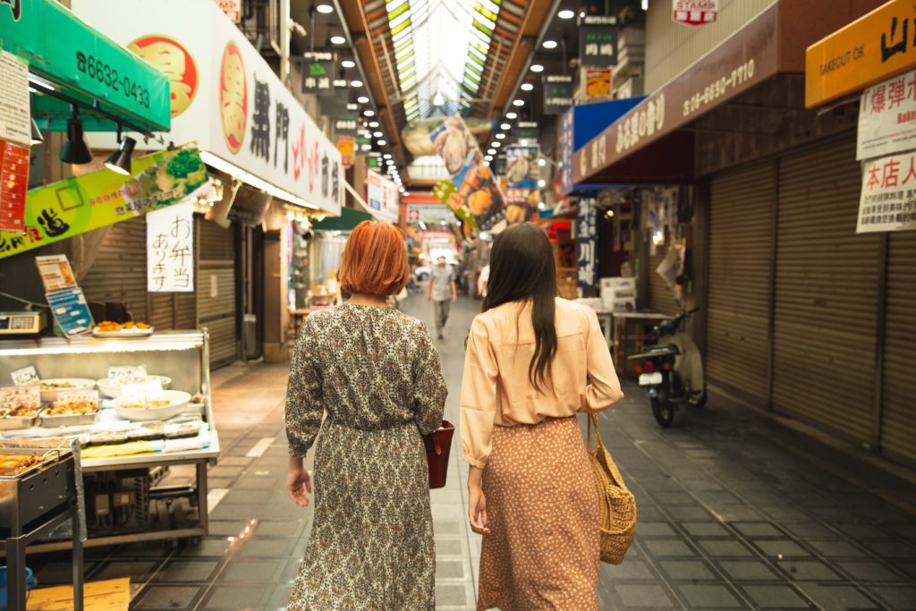 Two customers walking on the streets and shopping