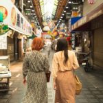 Two customers walking on the streets and shopping
