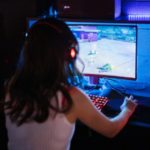 girl playing game on pc