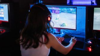 girl playing game on pc