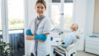A dentist smiling in her dental clinic.