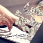 Man making money with cryptocurrency on his laptop.