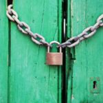 Office gate locked with a lock and chain.