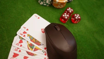 Poker game being played with cards,dice and coins.