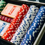 Poker coins and cards placed in a box