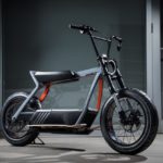 A black and orange bicycle parked.