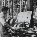 A labourer working with the machines in a factory