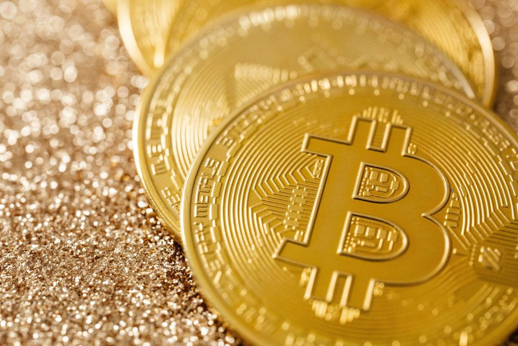 Golden Bitcoins placed on one another,