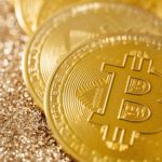 Golden Bitcoins placed on one another,