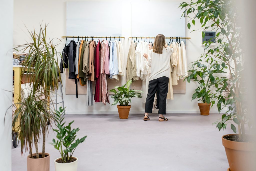 A woman looking for clothes in a boutique.