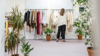 A woman looking for clothes in a boutique.