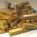 Gold bars piled up in different patterns.