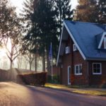A beautiful brown house with slope roofs.