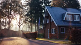 A beautiful brown house with slope roofs.