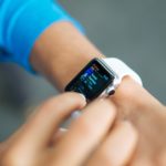 A student checking out some stuff on her smart watch.