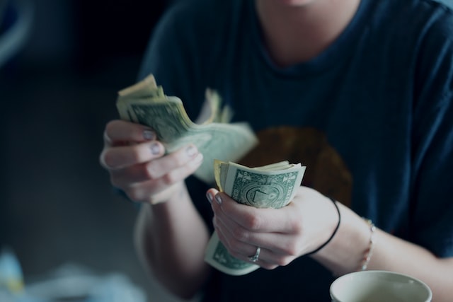 A woman counting money.