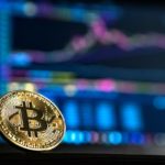 A golden bitcoin with letter B engraved on it.