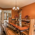 A dining area with stunning tables, chairs, and timeless decoration pieces!