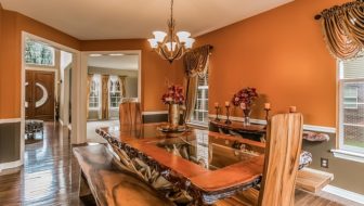 A dining area with stunning tables, chairs, and timeless decoration pieces!
