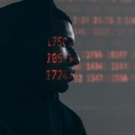 A man trying to steal data.