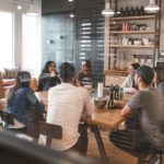 A team of employees sitting in a well furnished office.