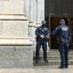 Professional Security guards standing outside the company.