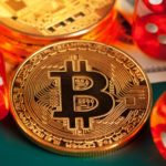 A golden bitcoin and red dice.