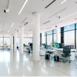 An office with many desks with systems.