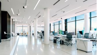 An office with many desks with systems.