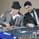 Players playing gambling with cards and dices.