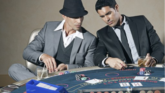 Players playing gambling with cards and dices.