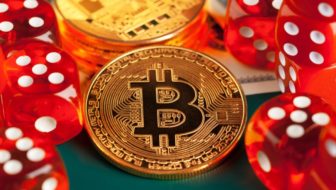 A golden bitcoin and red dice.