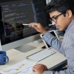 A man working on the desktop.