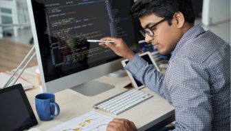 A man working on the desktop.