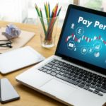 Pay Per Click displayed on laptop screen.