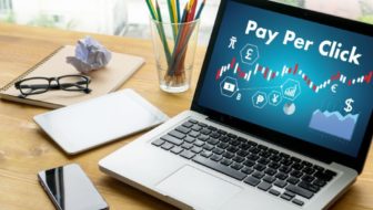 Pay Per Click displayed on laptop screen.