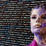 Human with software language displayed on screen.