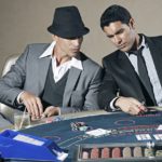 The players gambling in a casino.