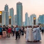 The beautiful Dubai city with people and sky scrapers.